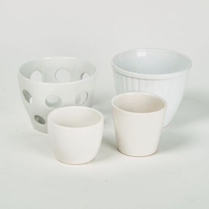 A Collection of Four White Cache Pots