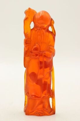 A Chinese amber ShouXing ornament