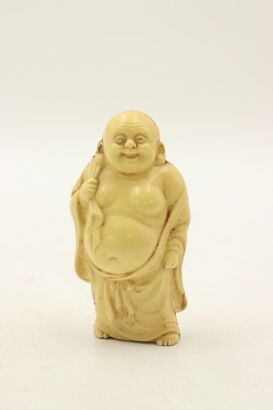 A Japanese early 20th century small plastic buddha statute