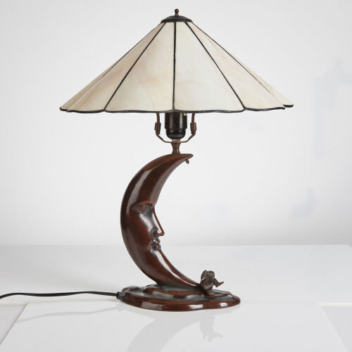 A Cast Steel Lamp with Tiffany Style Shade