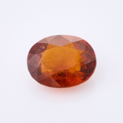 A Loose 4.91ct, Oval Mixed cut Hessonite Garnet