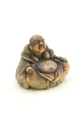 A Japanese 20th century porcelain small seated buddha (minor damaged)