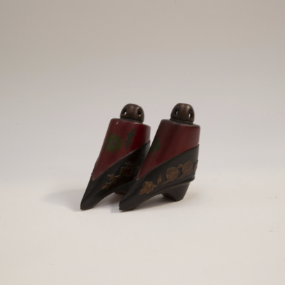 A pair of Chinese red lacquer wooden miniature shoes ornament