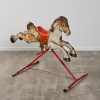 A Mobo Metal Rocking Horse on Stand