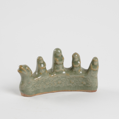 A Chinese Ming dynasty Longquan celadon-glazed pen holder