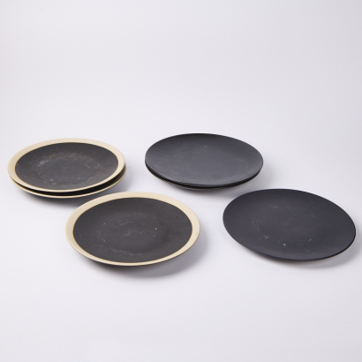 An Assortment of Dark Coloured Dinner Plates