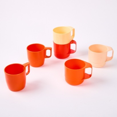 A Set of Six Orange and Beige Plastic Mugs