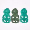 A Trio Of Plastic Hei Tikis