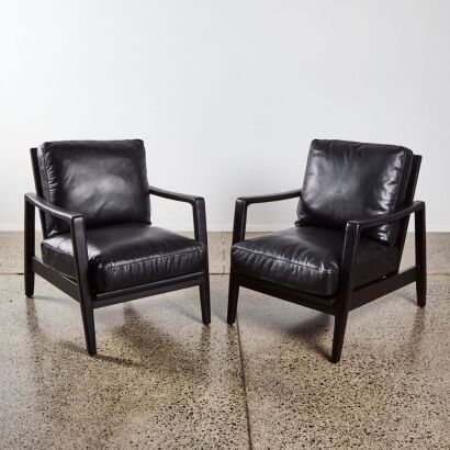 A Pair of Cabana Buckle Back Leather Chairs with Ebonised American Ash Frame