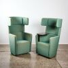 A Pair of Green Swivel Isolation Chairs