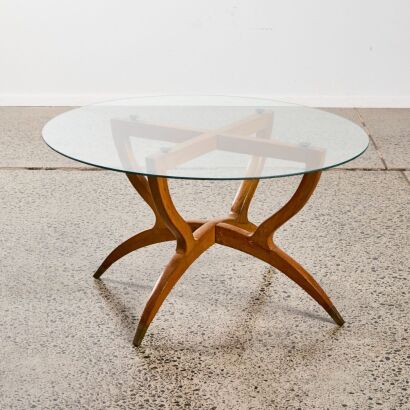 A Mid-Century Glass Top Coffee Table