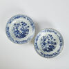 A pair of Chinese early Qing dynasty blue and white flower pattern dishes