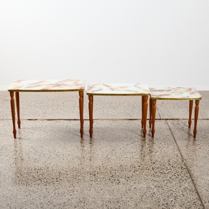 A Trio of Nesting Tables with Glass Marble Design Tops