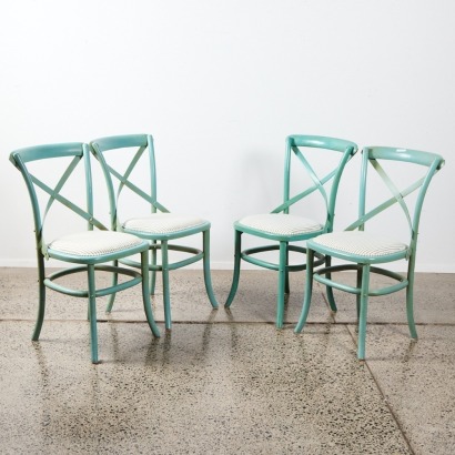 A Set of Four Coquette Dining Chairs