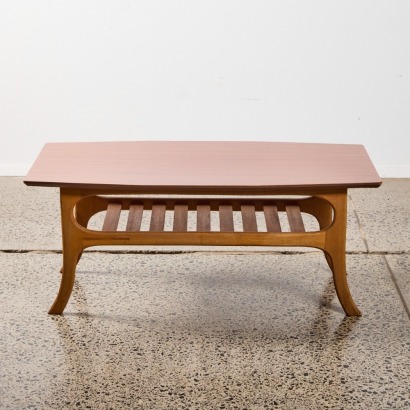 A Mid Century Coffee Table With Formica Top