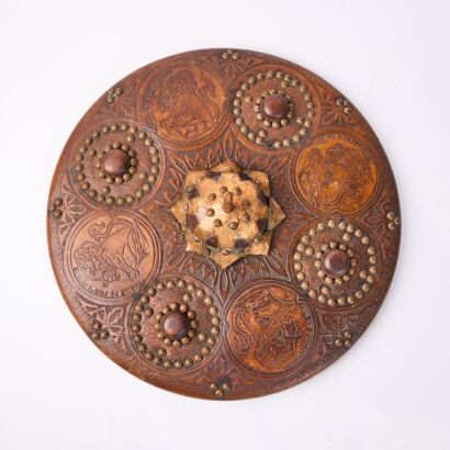 An Embossed Leather And Copper Shield