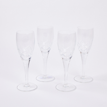 A Set Of Four Crystal Champagne Coupes