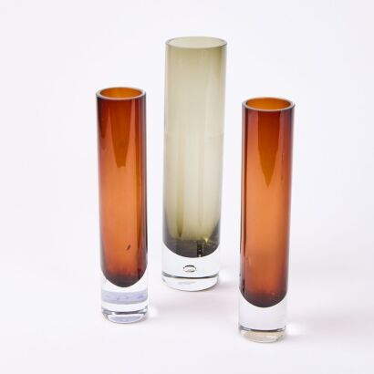 A Set of Three Coloured Glass Specieman Vases
