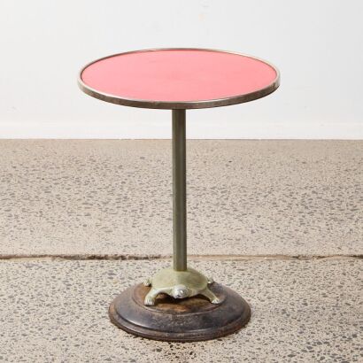 An Art Deco Side Table With A Turtle Base