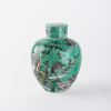 A Chinese Qing dynasty biscuit-enamelled sancai 'flower and bird' covered jar