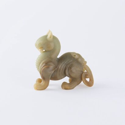 A Chinese Han dynasty style jade carved ‘mythical beast’ ornament