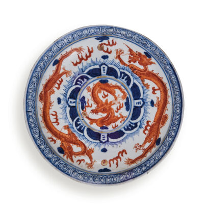 A Chinese Qing Dynasty Blue and White Saucer with copper red dragons pattern