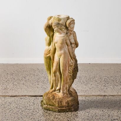 A Large Concrete Plinth Of The Four Graces