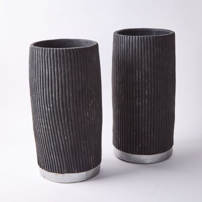 A Pair Of Black Ceramic Pots