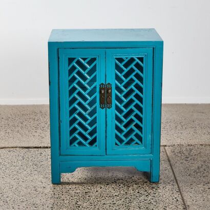 An Oriental Style Cabinet With Lattice Doors