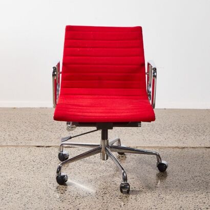 An Eames Style Desk Chair With Red Upholstery & Chrome Frame