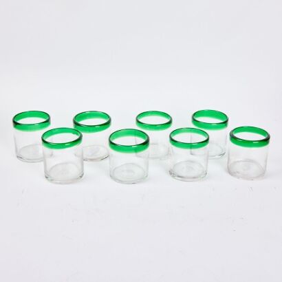 A Set Of Eight Green Rimmed Water Glasses