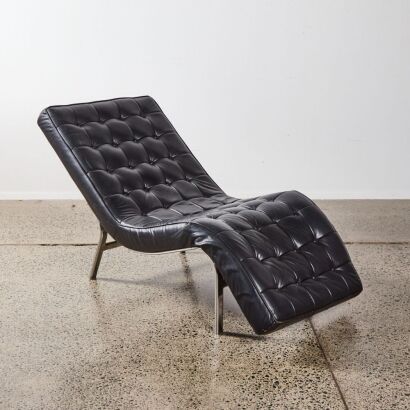 A Black Italian Leather Button Backed Chaise With Chrome Frame