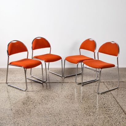 A Set of Four Chrome and Red Upholstered Chairs