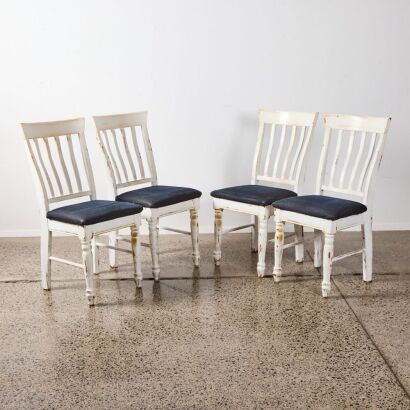 A Set of Four Farmhouse Style Dining Chairs
