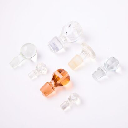 A Collection Of Seven Glass Stoppers