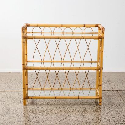 A Three Tier Glass Cane Shelf