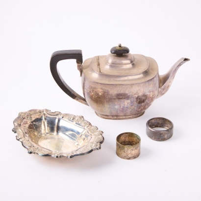 A Sterling Silver Teapot with Three Silver Pieces