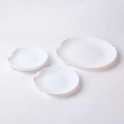 A Set of Four Milk Glass Seashell Plates with Larger Platter