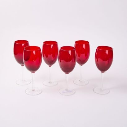 A Set of Six Clear Stemmed Red Wine Glasses