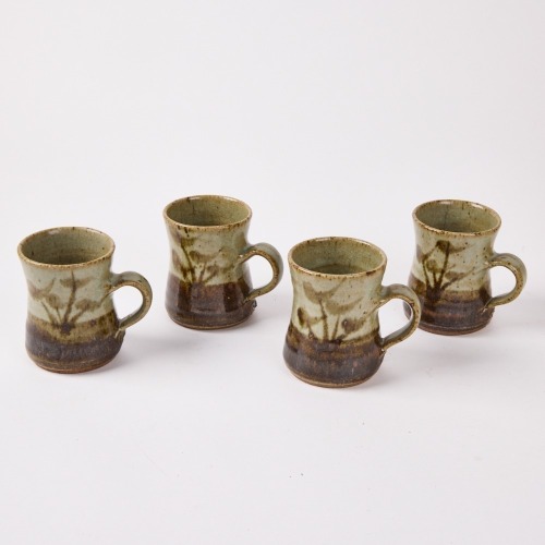 A Set of Four Mirek Smisek Mugs