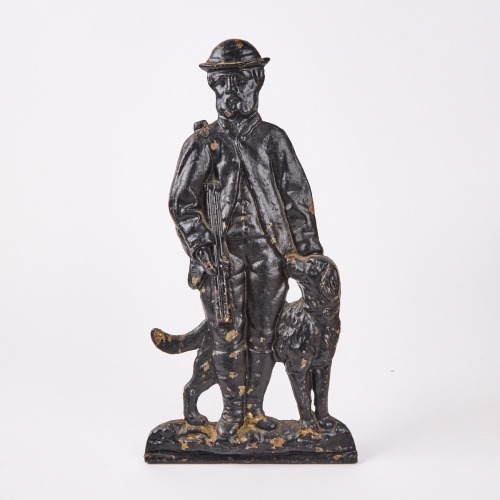 A Decorative Victorian Cast Iron Hunting Man With His Dog