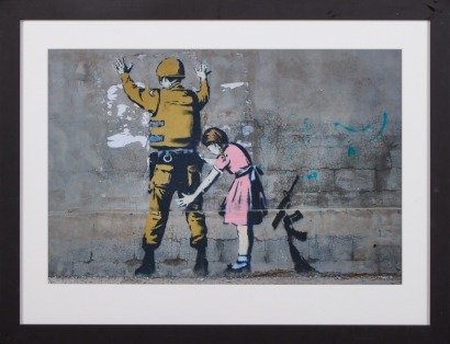 A Banksy Framed Print Girl Frisking Soldier