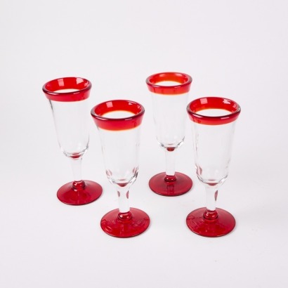 A Set Of For Handblown Red Mexican Flutes