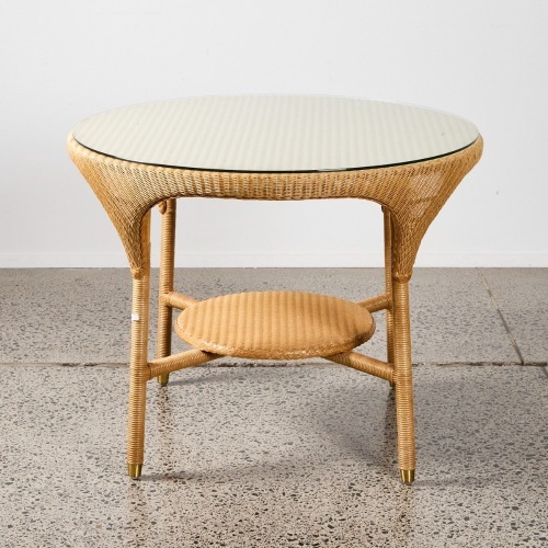 A Lloyd Loom Table With A Glass Overlay