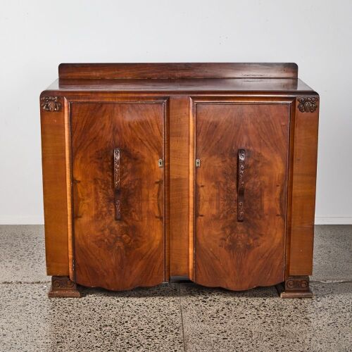 An Art Deco Walnut Double Bow Front Console With Carved Handles