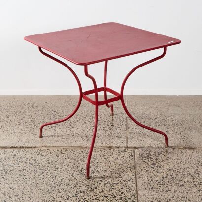 A French Set Of Red Metal Outdoor Table And Chairs