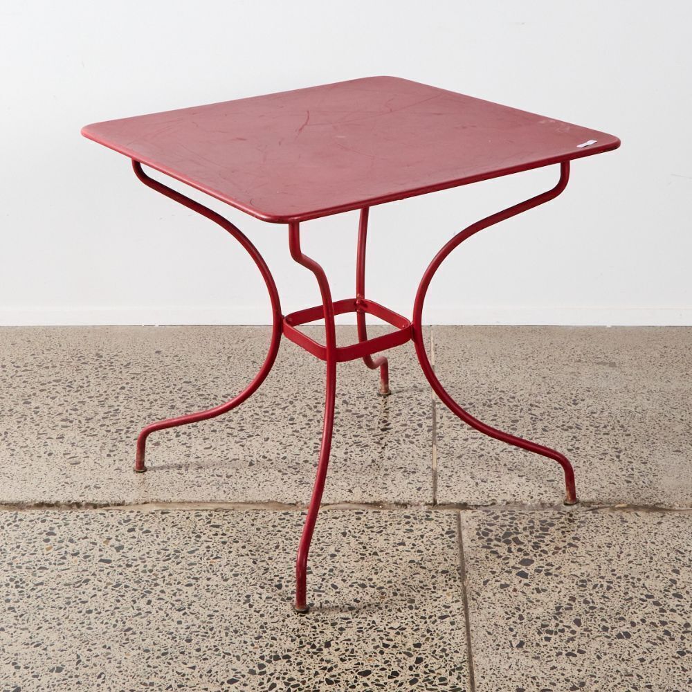 A French Set Of Red Metal Outdoor Table And Chairs