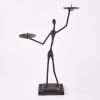 A Metal Figural Double Candle Holder On Plinth