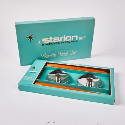 A Starlon Stainless Steel Candle Holders And Candles