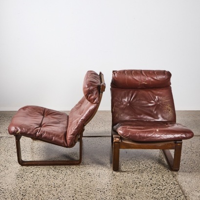 A Pair Of Tessa T8 Lounge Chairs